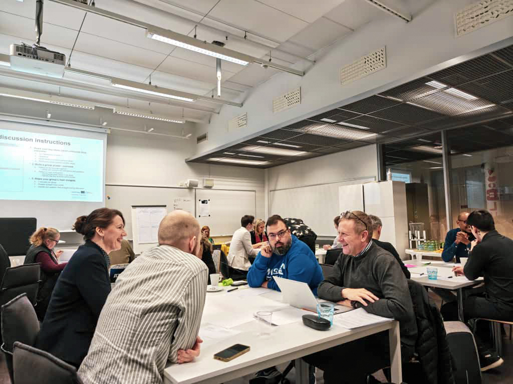 People discussing at the Bootcamp event