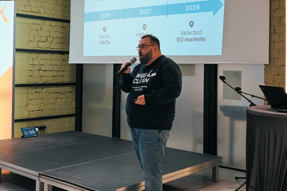 A man pitching on a stage.