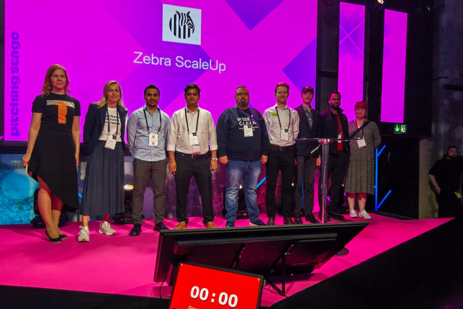 Zebra ScaleUp cohort at the Latitude59 event stage.